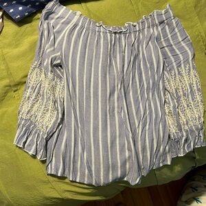 Over the shoulder blue blouse